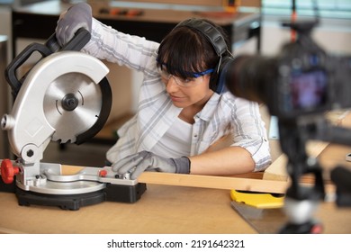 Attractive Female Carpenter Using Some Power Tools For Her Work