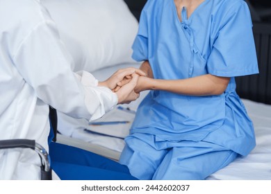 Attractive female Caucasian female doctor and psychologist gives advice, encouragement to female Asian patients. from depression in hospital examination room. cognitive behavioral therapy CBT - Powered by Shutterstock