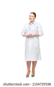 Attractive Female Doctor In White Coat Looking At Camera Isolated On White Background