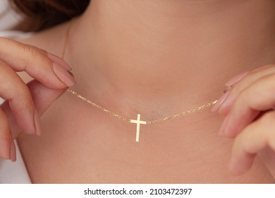 Attractive female model cross silver necklace. Woman wearing religious jewellery. Jewelry photo for e commerce, online sale, social media. - Shutterstock ID 2103472397