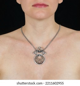 Attractive Female Silver Chain With Pendant Hangs Around Neck Of A Young Girl. Jewelry Photo For E Commerce, Online Sale, Social Media.