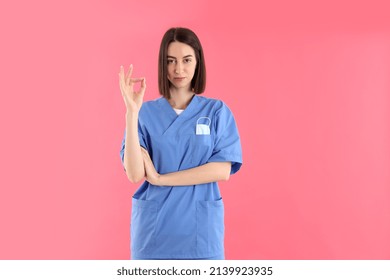 Attractive Female Trainee Nurse On Pink Background