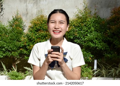 Attractive Filipina Female Posing With Mobile Phone