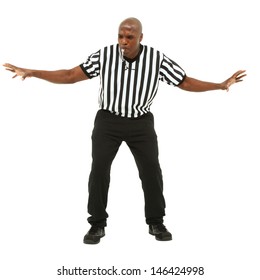 Attractive Fit Black Man In Referee Uniform Facing Front And Blowing Whistle.