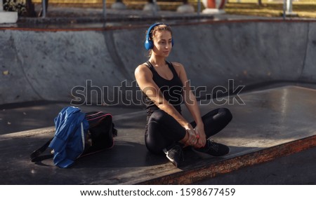 Similar – Beautiful young photographer sitting on the ground with the camera in the country