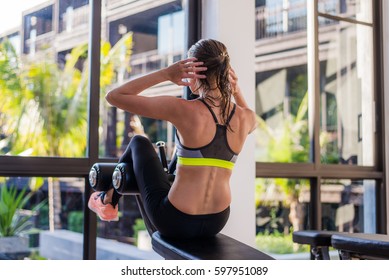 Attractive Fit Woman Working Out Abs In Fitness Gym At Luxury Resort Hotel With A Great View During Summer Vacation