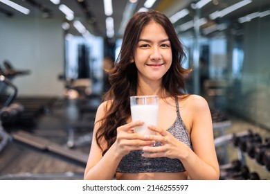 Attractive Fitness Asian Woman Finishing Workout And Drinking Protein Milk Shake Vitamins After Training. Bodybuilding. Healthy Lifestyle.