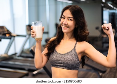 Attractive Fitness Asian Woman Finishing Workout And Drinking Protein Milk Shake Vitamins After Training. Bodybuilding. Healthy Lifestyle.