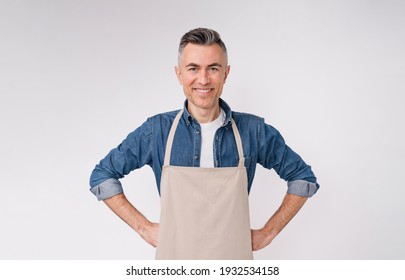 Attractive friendly mature barista isolated over white background - Powered by Shutterstock