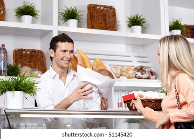 The attractive girl buys bread in shop - Powered by Shutterstock