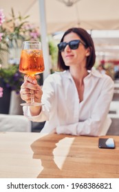 Attractive Girl Drinking Aperol In Restaurant Terrace