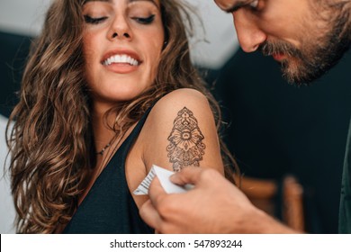 Attractive Girl Getting A Temporary Tattoo