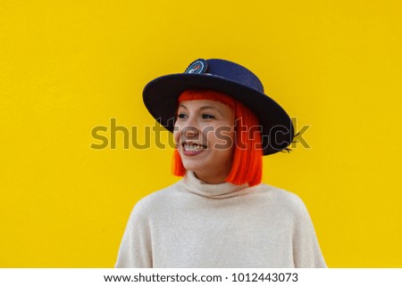 Similar – Attractive girl with a hat over a yellow wall