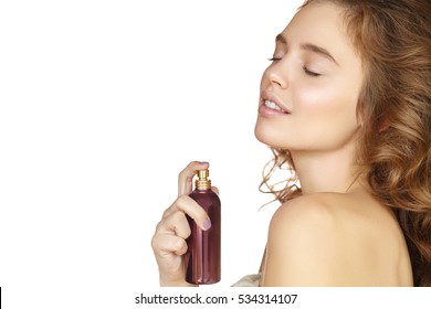 Attractive Girl With Perfume Bottle On White Background.