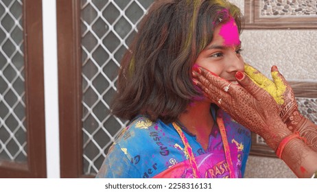 Attractive girl in pink colors Holi. Holi facial shot on spring color festival of Holi. Holi celebration concept. - Shutterstock ID 2258316131