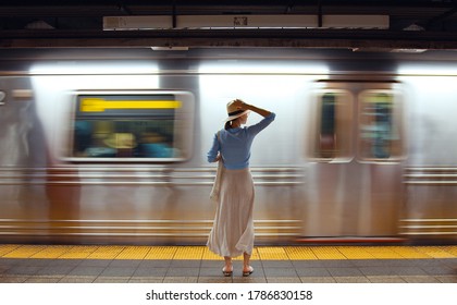 Attractive Girl Waiting For A Train In The Subway. USA, NYC 2019