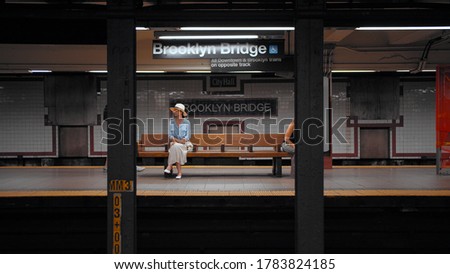 Attractive girl waiting for a train in the subway in New York City