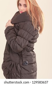 Attractive Girl In A Warm Quilted Coat /Jacket For Cold Days