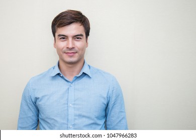 Attractive Handsome Smiling Positive Caucasian Happy Business Man. Closeup Portrait Caucasian Polite Middle Age Man Wearing Blue Shirt 