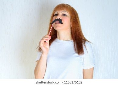 Attractive Happy Middle Aged Woman Having Fun With A Fake Moustache On Stick. Senior  Female In The Period Menopause. Lifestyle, Women's Health Concept : Playful Blond Red Hair Mature Ready For Party.