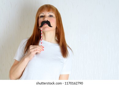 Attractive Happy Middle Aged Woman Having Fun With A Fake Moustache On Stick. Senior  Female In Period Menopause. Lifestyle, Women's Health Concept : Playful  Mature Ready For Party. Impostor Syndrome