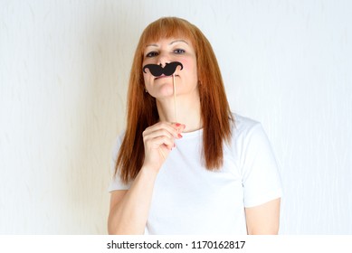 Attractive Happy Middle Aged Woman Having Fun With A Fake Moustache On Stick. Senior  Female In Period Menopause. Lifestyle, Women's Health Concept : Playful  Mature Ready For Party. Impostor Syndrome