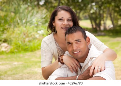 Attractive Hispanic Couple Portrait in the Park.