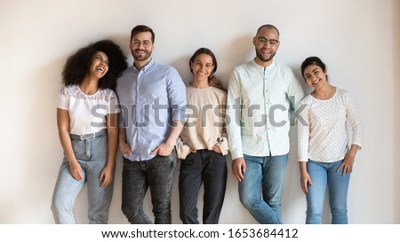 Similar – Image, Stock Photo Happy jovial healthy young woman posing between building in urban environment with sporty atmosphere