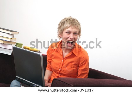 Attractive joyful woman over the laptop
