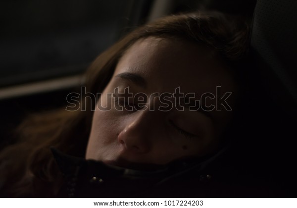 Attractive\
lady sleeping on passenger seat in the\
car