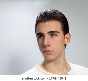 Attractive male model with short hair posing in studio on isolated background. Style, trends, fashion concept. - Powered by Shutterstock