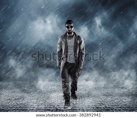 Attractive man with bathing cap and guggles is walking through the rain Stock fotó © 