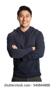 An Attractive Man In His 20s Standing Against A White Background Wearing A Blue Hood Shirt Smiling, Looking At Camera.