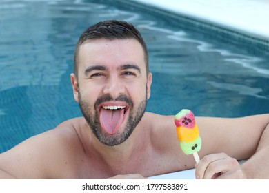 Attractive Man With An Ice Cream  In A Pool 