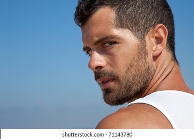 Attractive man looking at camera with anger. Threatening.