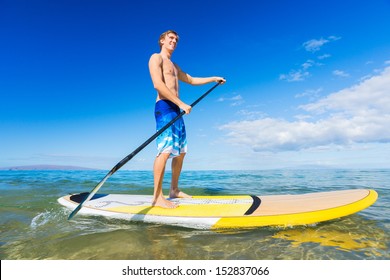 Attractive Man On Stand Up Paddle Board, SUP, Tropical Blue Ocean, Hawaii