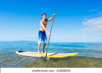 Attractive Man On Stand Up Paddle Board, SUP, Tropical Blue Ocean, Hawaii