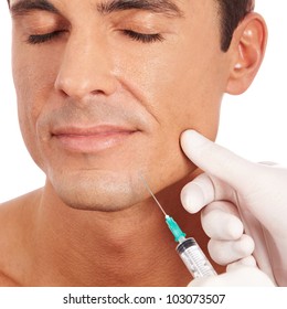 Attractive Man At Plastic Surgery With Syringe In His Face