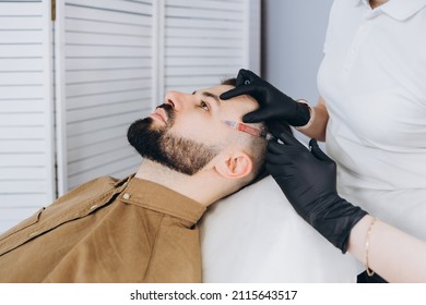 An Attractive Man Receives Mesotherapy Injections To Treat Hair Loss At The Clinic. Injections Into The Skin And Scalp