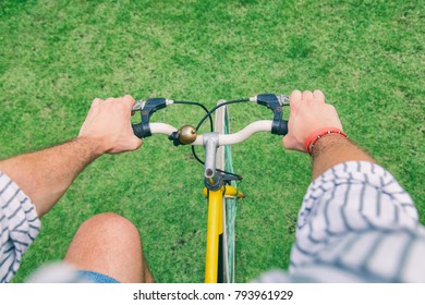 Attractive man riding old bicycle.