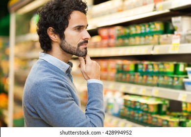 Attractive Man Shopping In A Supermarket