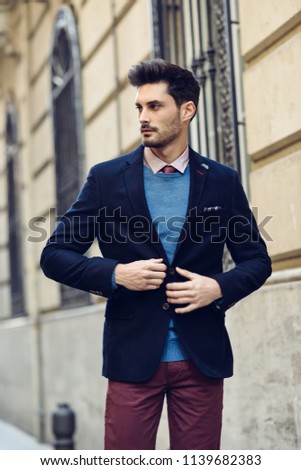 Similar – Thoughtful young man sitting on an urban bench