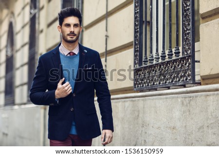 Similar – Young man wearing winter clothes in the street.