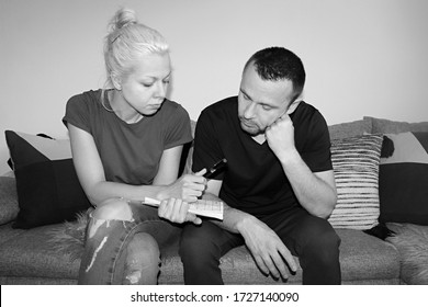 Attractive Man And Young Woman Solving Painted Crossword At Home Quarantine