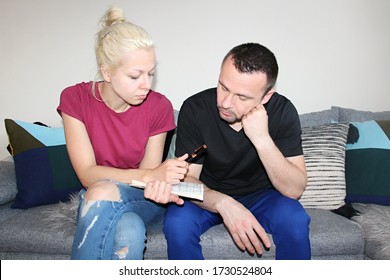 Attractive Man And Young Woman Solving Painted Crossword At Home Quarantine