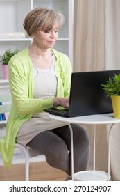 Attractive Mature Woman Dating Online On Laptop