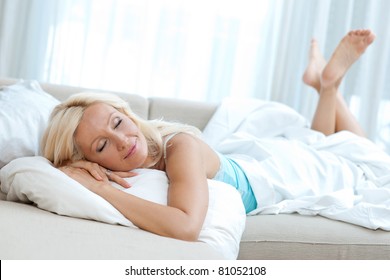 Attractive Mature Woman Sleeping In Her Bed