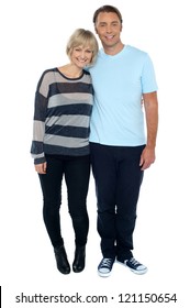 Attractive Middle Aged Love Couple. Full Length Studio Shot On White Background.