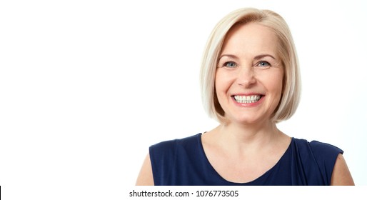 Attractive Middle Aged Woman With Beautiful Smile On White Background. Face Close Up