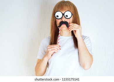 Attractive Middle Aged Woman Having Fun With A Fake Moustache And Glasses. A Senior  Female In The Period Of Menopause. Lifestyle, Woman Health Concept :  Playful Blond Red Hair Mature Ready For Party